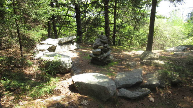 The cairn and sitting area at summit of Thumb Mountain