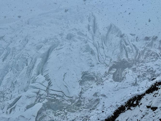 Crevasses of Coleman Glacier and a waterfall