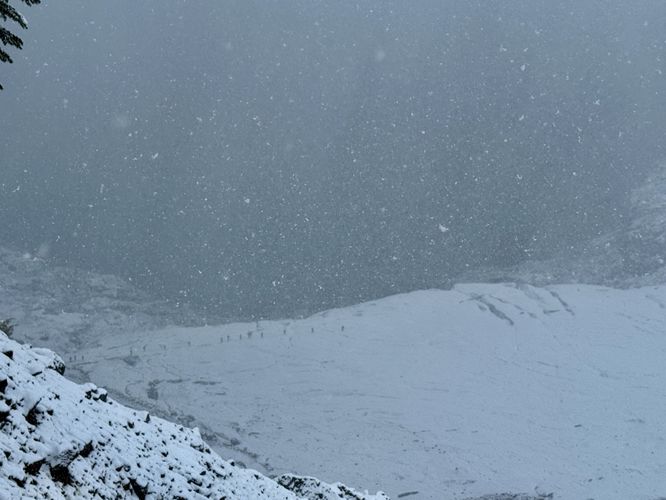 A group of mountaineers head out onto Coleman Glacier