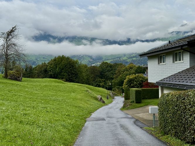 Hiking down Kirchenackerstrasse in Filzbach, Switzerland to reach the Helsana Trail