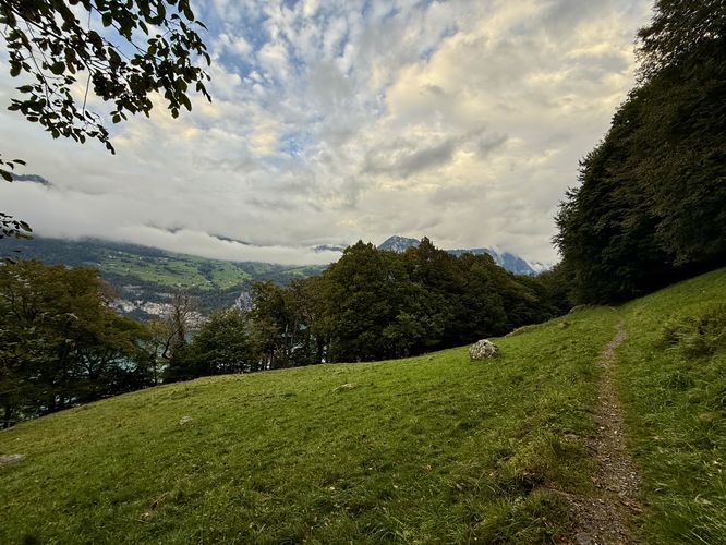Open meadow along the trail provides obstructed views of Walensee and Amden, Switzerland