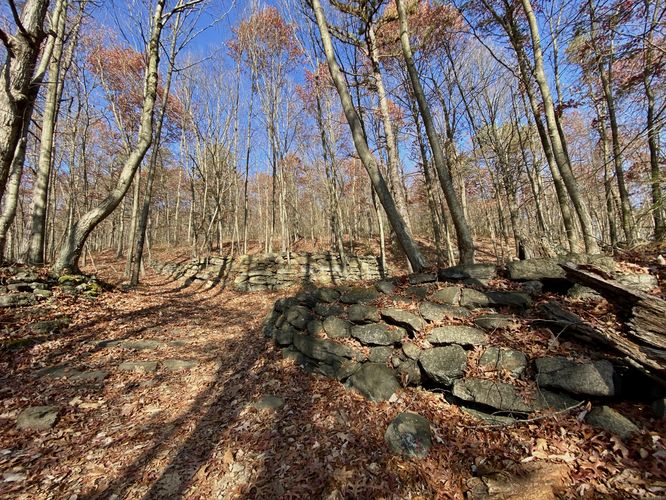 Stone walls appear to be old staging stations for the long-abandoned railroad