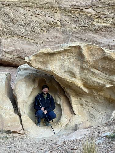 Me (Dave) hanging in an "egg" I found along the Hickman Bridge Trail - natural water-carved rock cutout