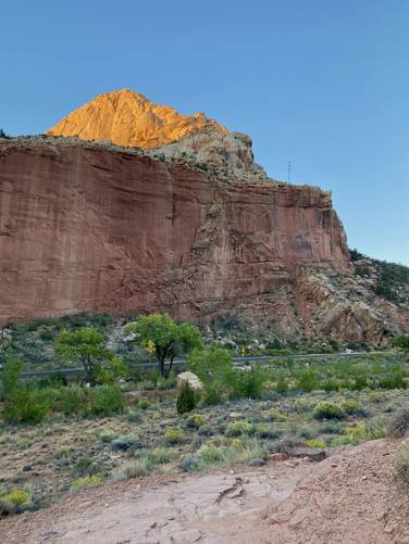 Beautiful views of the sunrise on rock ledges at Capitol Reef National Park
