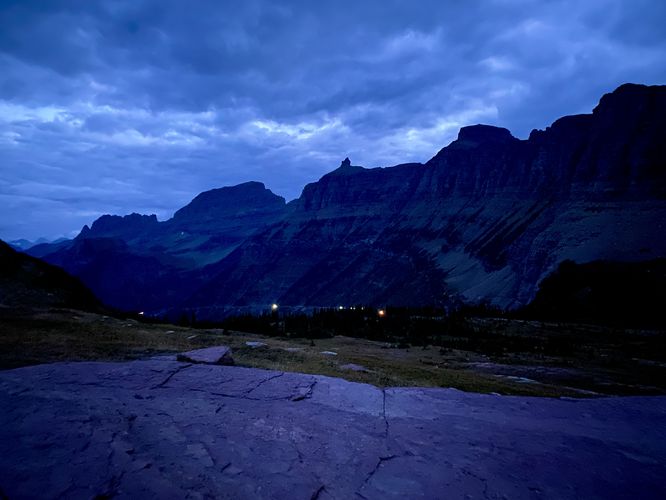 View of the Garden Wall (glacial arete) and the Going-to-the-Sun Road from Logan Pass with vehicles ascending