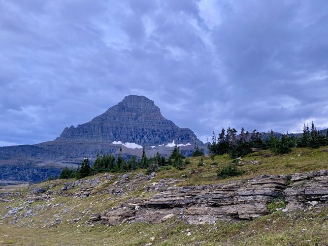 Step-like rock ledges with Reynolds Mountain in the background