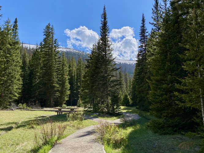 Trail winds through Hidden Valley with views of mountains above