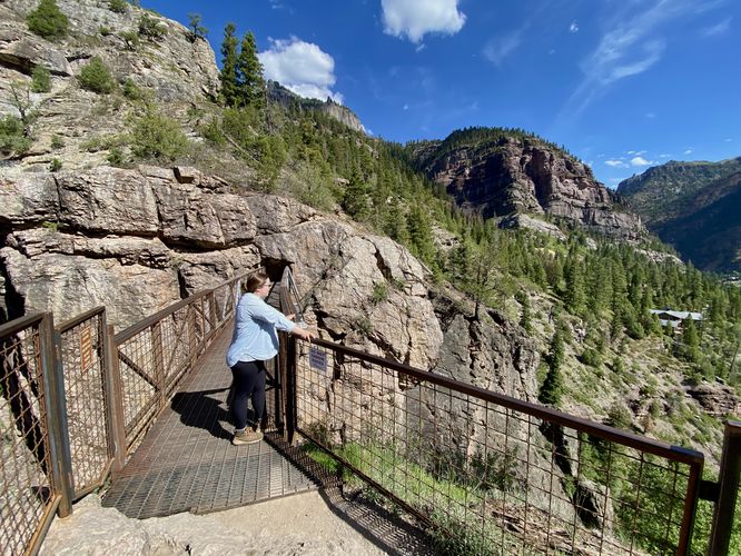 Bridge leads into a tunnel above Box Canyon Falls