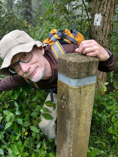 Appalachian Trail post with metal engraved information and the trail logo/ blaze