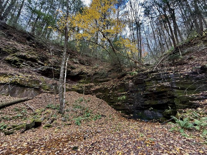 Inside the old quarry with a seasonal cascade