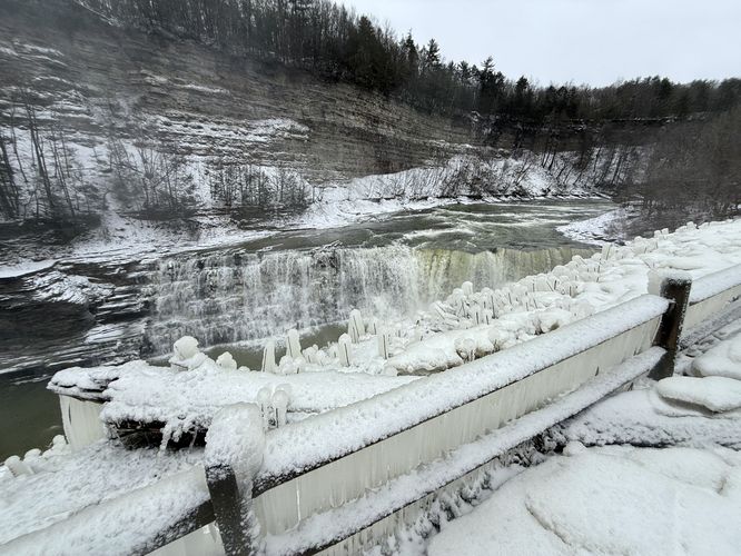 Wide angle shot of Lower Falls with frozen-over railing