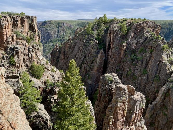 Jagged "peaks" sit within the Black Canyon