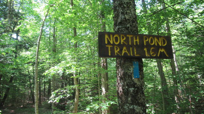 Trail sign and blaze for the North Pond Trail