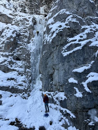 Victor belaying Barry Blanchard as he climbs to set the anchor
