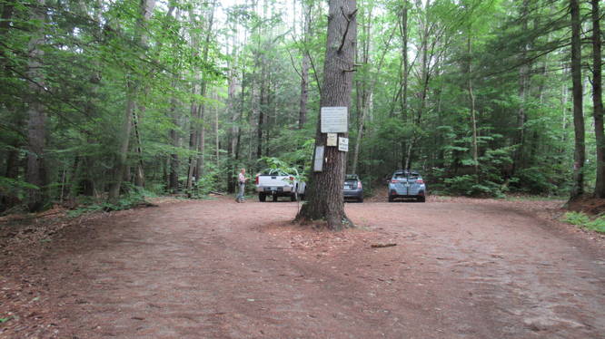 Parking area and Trail map on a tree