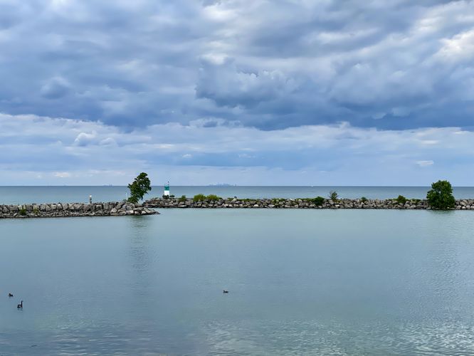 View of Lake Ontario, the Jordan Harbor Lighthouse, and Toronto on the horizon