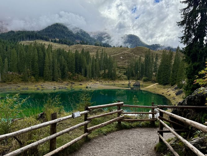 Lago di Carezza trail, Dolomite mountains, and a view of the turquoise lake