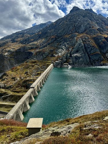 Alps stand above Lago di Lucendro dam