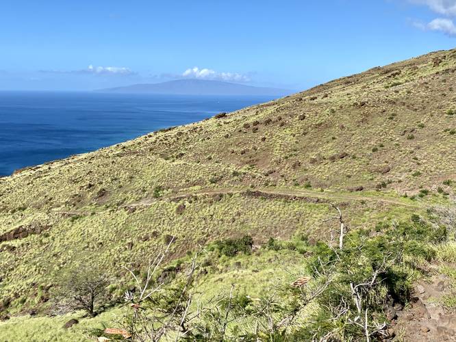 View of Lanai with the Lahaina Pali Trail winding around the mountain
