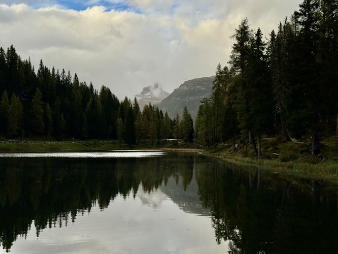 North-facing view of Lake Antorno and distant alpine mountains