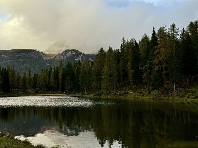 View of Lago d'Antorno with a cloudy Tre Cime di Lavaredo
