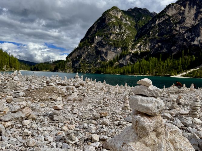Hundreds of rock cairns sit along the western shore of Lago di Braies