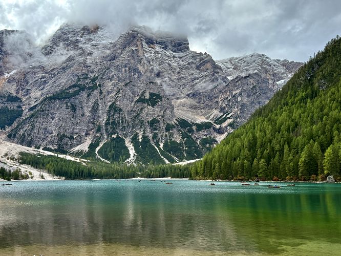 Beautiful views of Lago di Braies, row boats, and alpine mountains