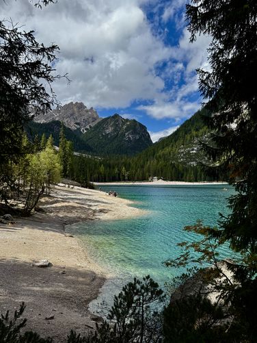 Vibrant turquoise hues of Lago di Braies from the southeast corner