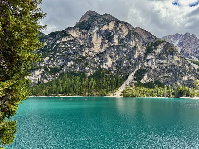 A stunning view of Lago di Braies' turquoise waters from the western side of the loop trail