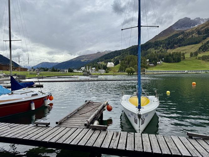 Boats moored at a dock along Lake Davos