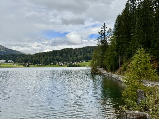 The Lake Davos Trail wraps around the turquoise-hued lake waters