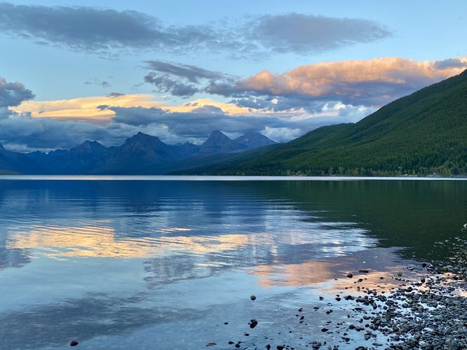 Alpine mountains reflection on Lake McDonald at sunset
