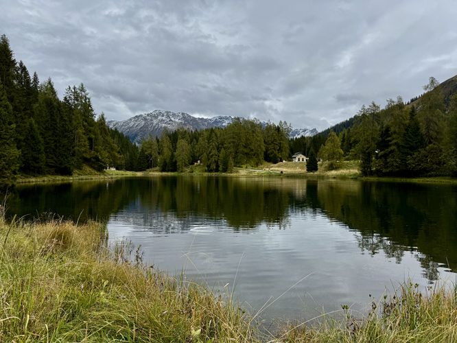 View of Schwarzsee and towering Alps from the south shore of the lake