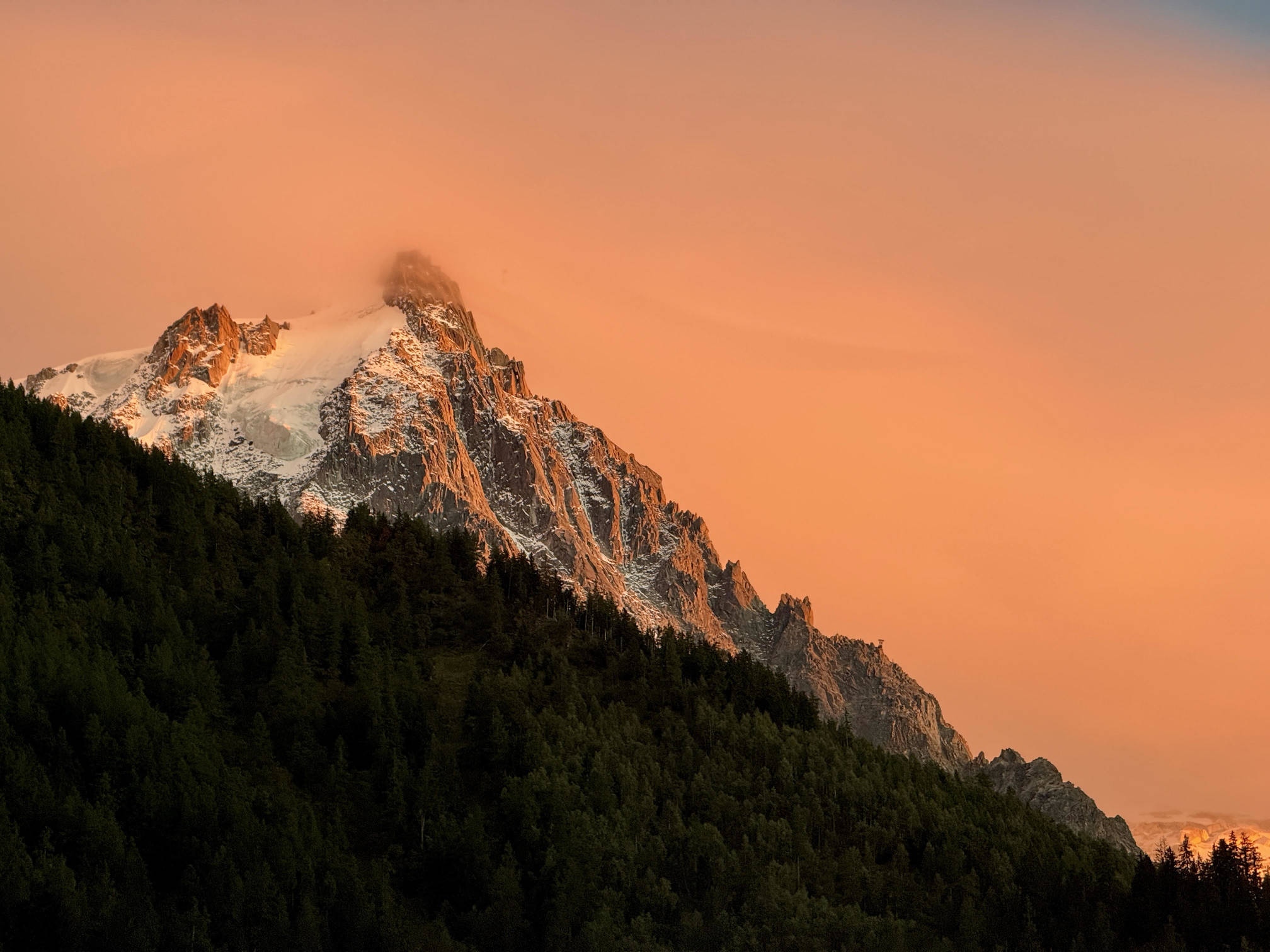 A sunset view of Aiguille du Midi as seen from the Chamonix Valley, France.