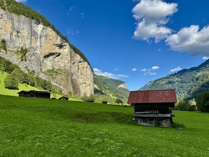 Staubbach Falls cascades into the valley as seen from the meadows