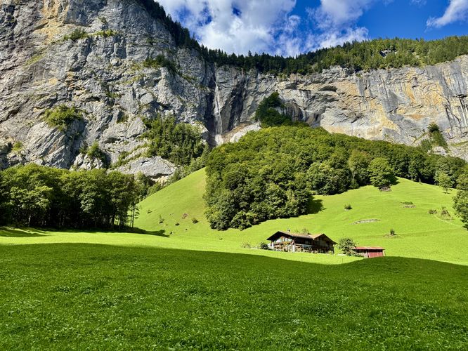 A quaint home sits below Spissbach Falls