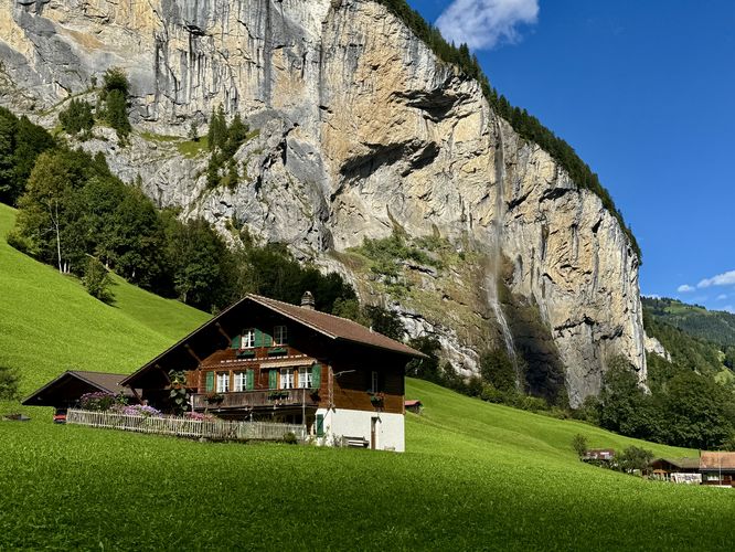 Beautiful view of Staubbach Falls and a home in the Lauterbrunnen Valley