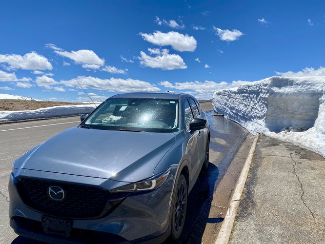 8-foot tall snowpack, higher than the car