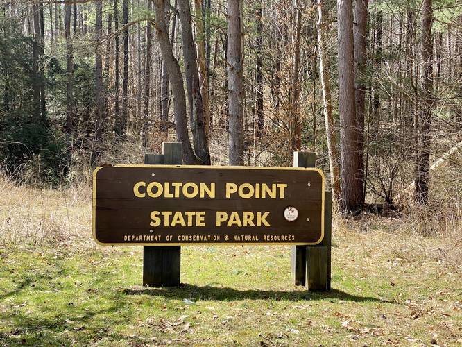Parking is located next to the Colton Point State Park sign