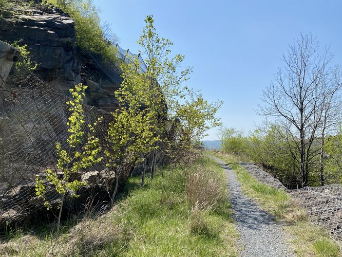 Rock slide fences protect the highway and hikers below