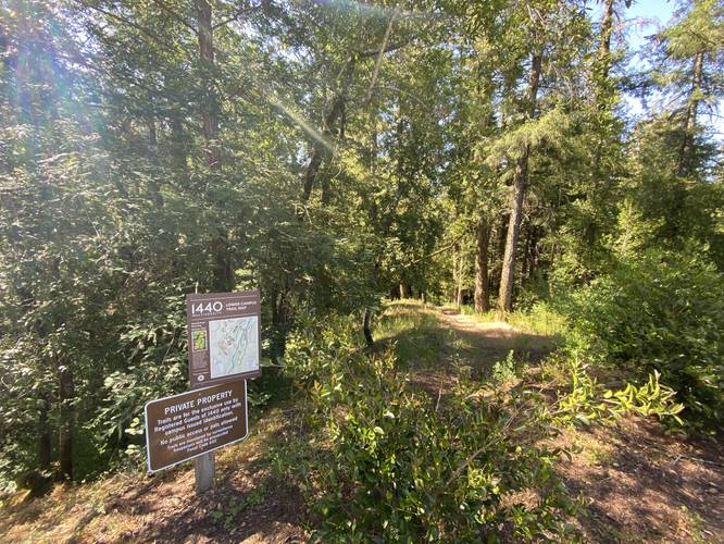 Trail continues behind parking lot