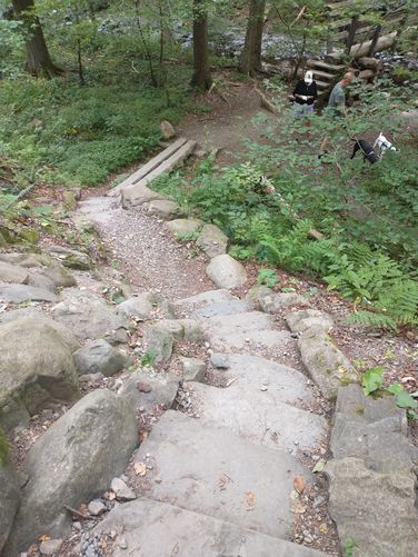 Stone steps guide hikers to another bridge and  another crossing