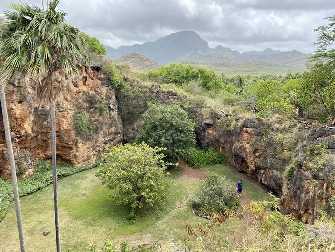 View of Makauwahi Cave sinkhole and Mt. Haupu in the distance
