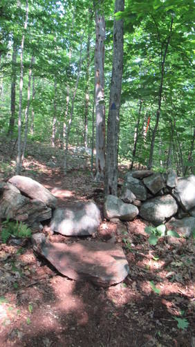 Trail through an old rock wall