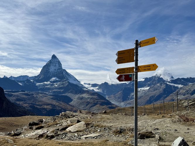 Trail signpost with a backdrop of the Matterhorn