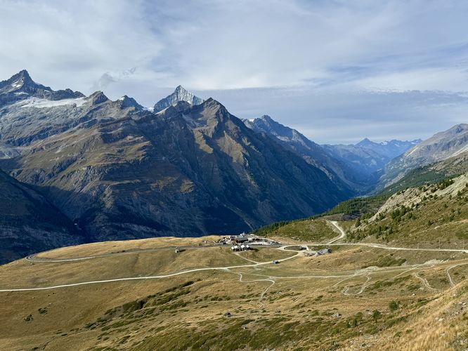Sweeping views of alpine meadows and towering Alps above Zermatt