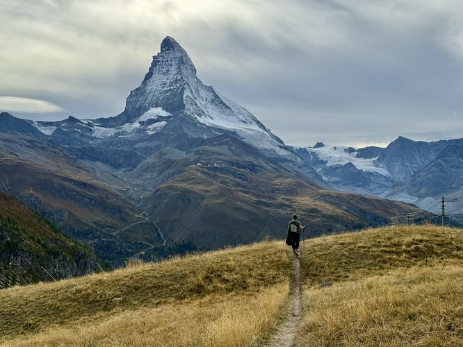 Hiking through alpine meadows with the Matterhorn in the background