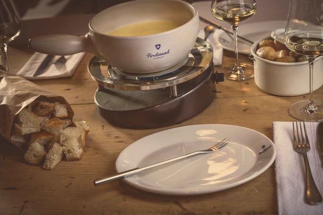 Fondue on a table at Restaurant Ferdinand in Zermatt, Switzerland