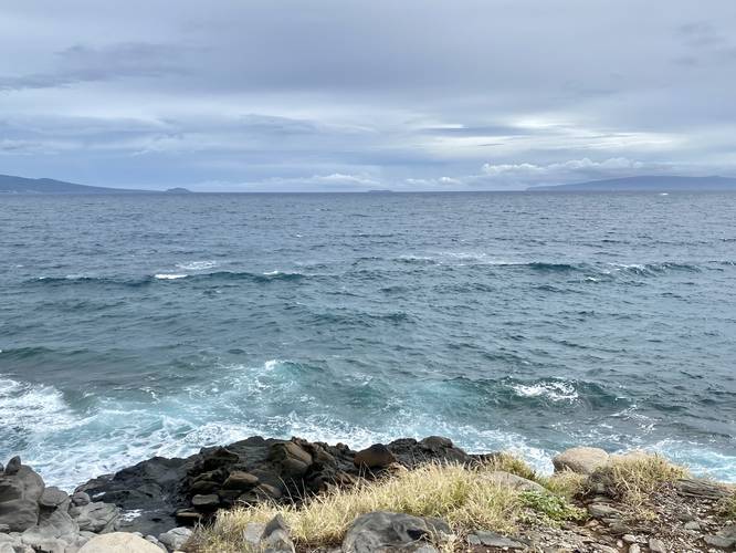 View of Molokini Crater and the island of Kaho'olawe with waves below from McGregor Point