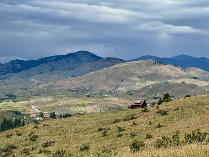View of rolling mountains and grasslands of the Winthrop area